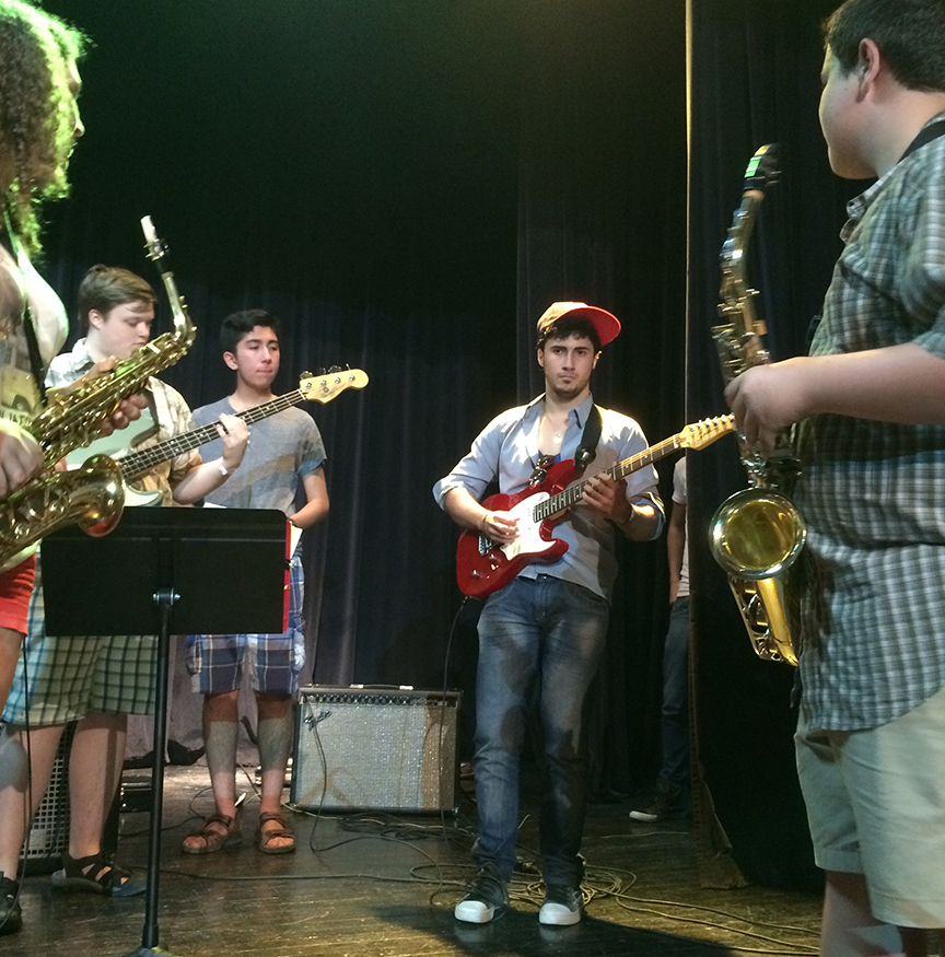 Cuban playing Myles' guitar